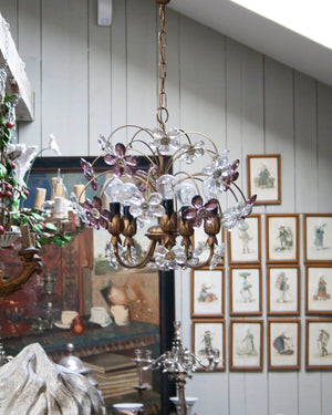 Chandelier with a brass structure in the shape of branches and crystal colored flowers  with five light holders. Italy