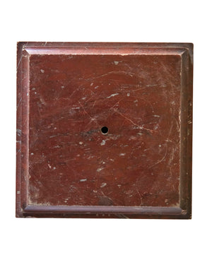 Square plinth carved in red marble 