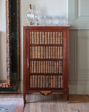 Low armoire Luis XVI with a “trompe l’oeil” front of books