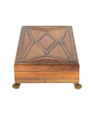 Engraved leather-lined jewelry box with brass feet and velvet interior