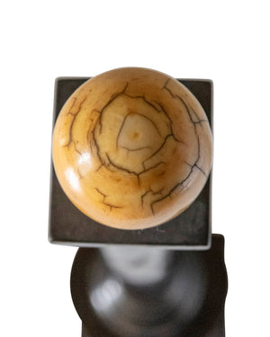Ivory ball on column made of carved ebony wood