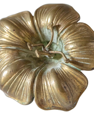 Golden bronze in the shape of a flower