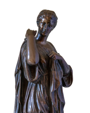 Bronze of a woman wearing a tunic
