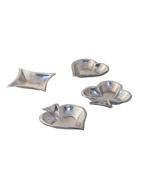 Set of four metal ashtrays shaped like the different suits of the deck