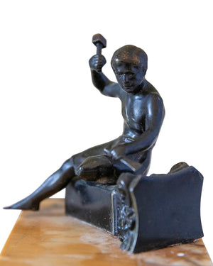 Bronze representing a young sculptor on marble plinth