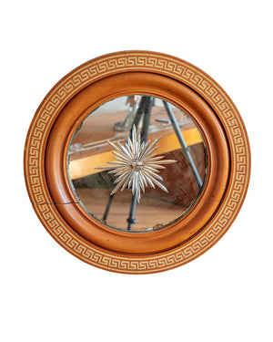 Round mirror with a carved moon