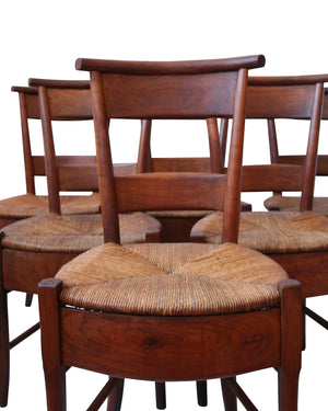 Set of six French chairs in walnut wood with skirt and bulrush wicker seat. Directoire style