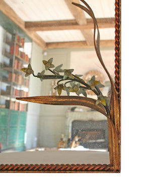 Mirror with plaited frame and iron flowers