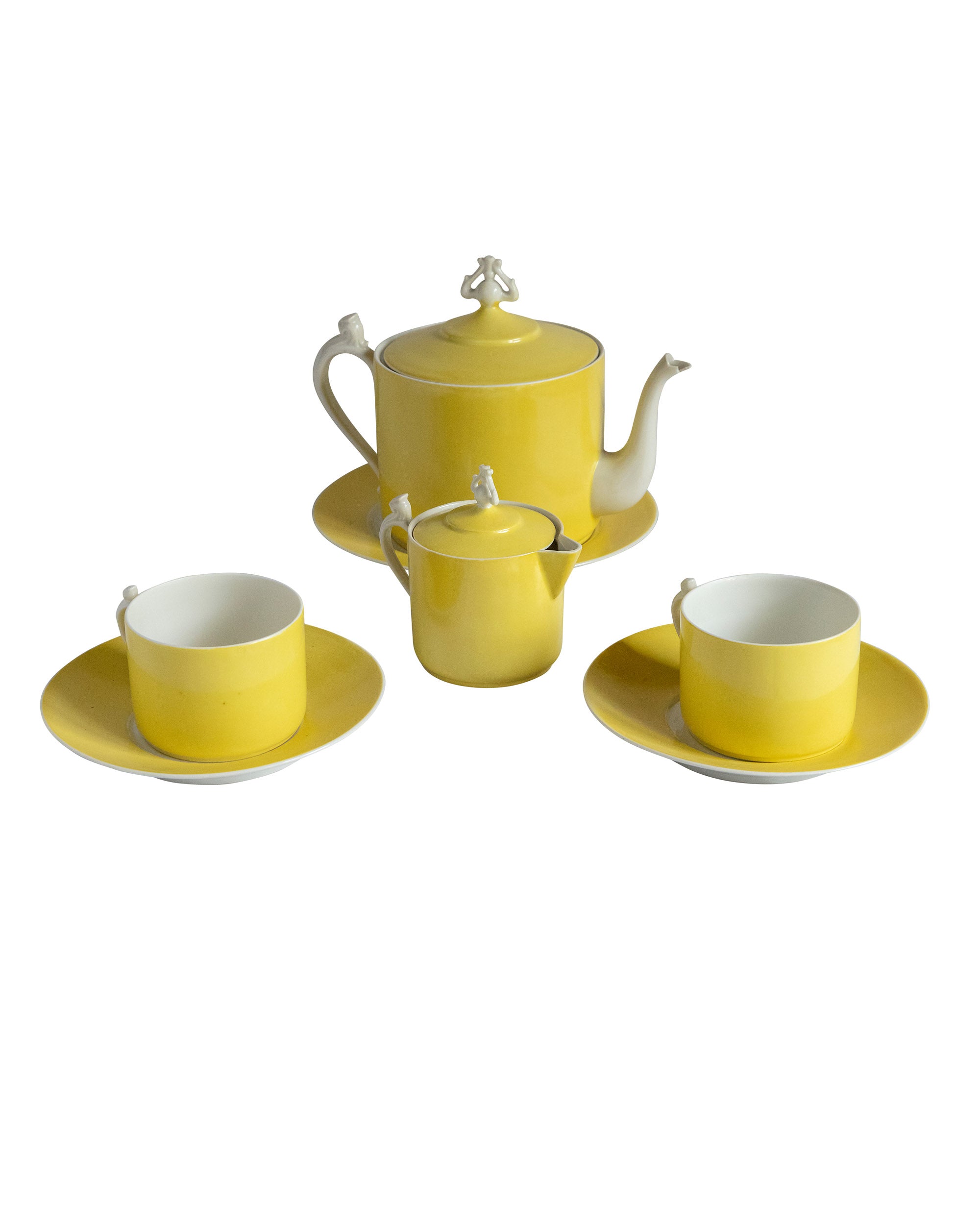 Yellow and white porcelain coffee set with ornaments on the handles