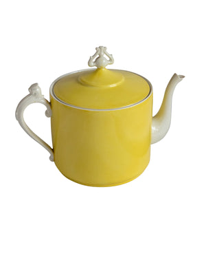 Yellow and white porcelain coffee set with ornaments on the handles