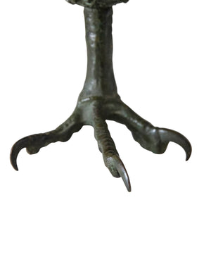 Bronze oil lamp shaped like a satyr with claw-shaped base