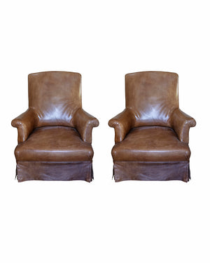 Pair of brandy leather armchairs
