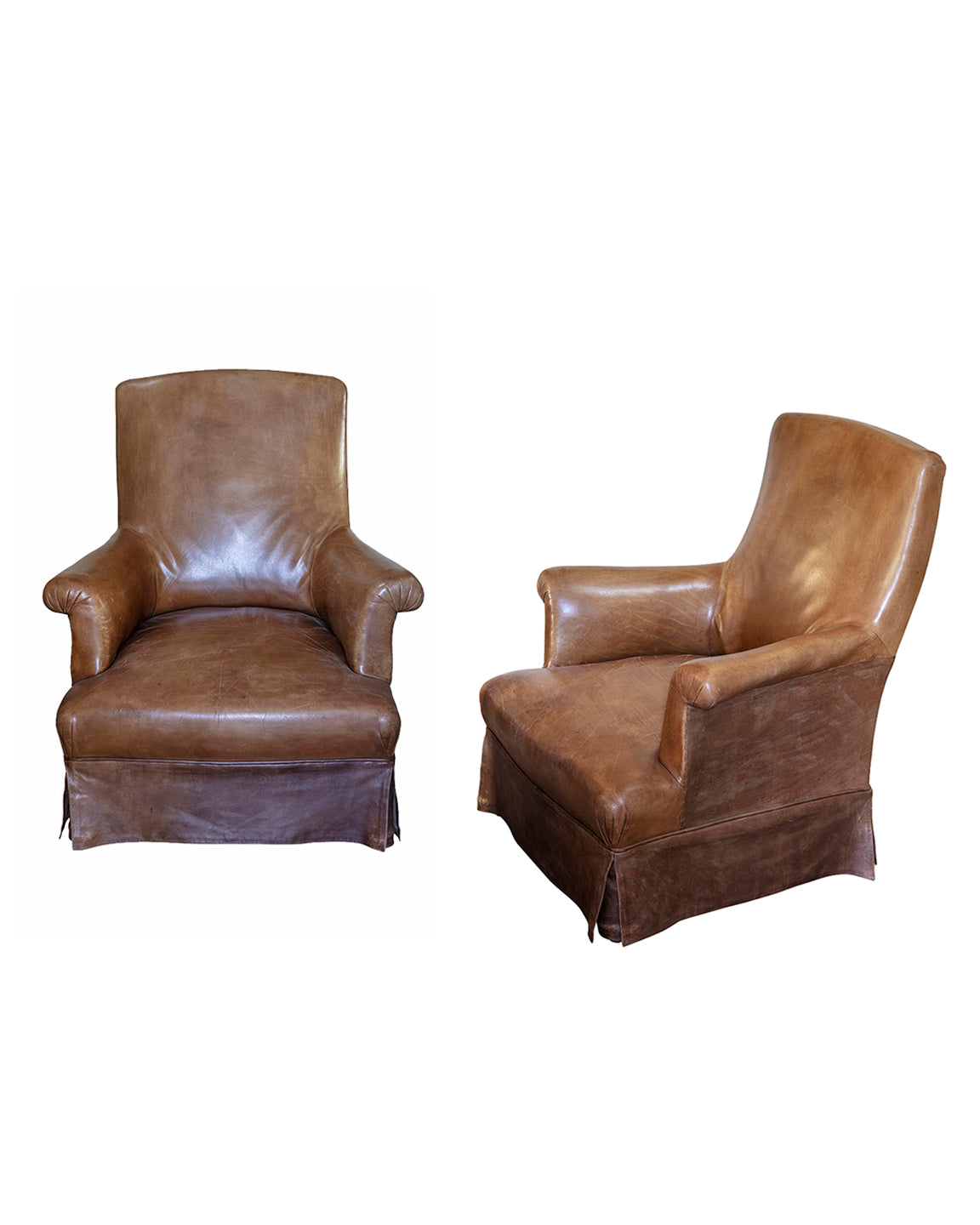 Paire de fauteuils crapauds en cuir fauve, debut XXème siècle