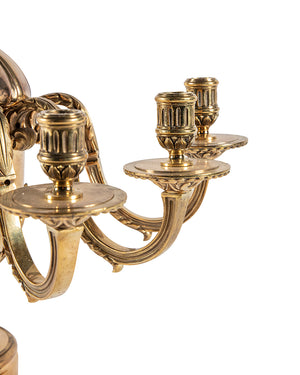 Pair of candelabra with three candle holders in golden bronze