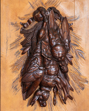 Pair of framed wood carvings with a hunting motif