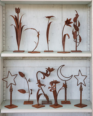 Pair of star-shaped iron sculptures