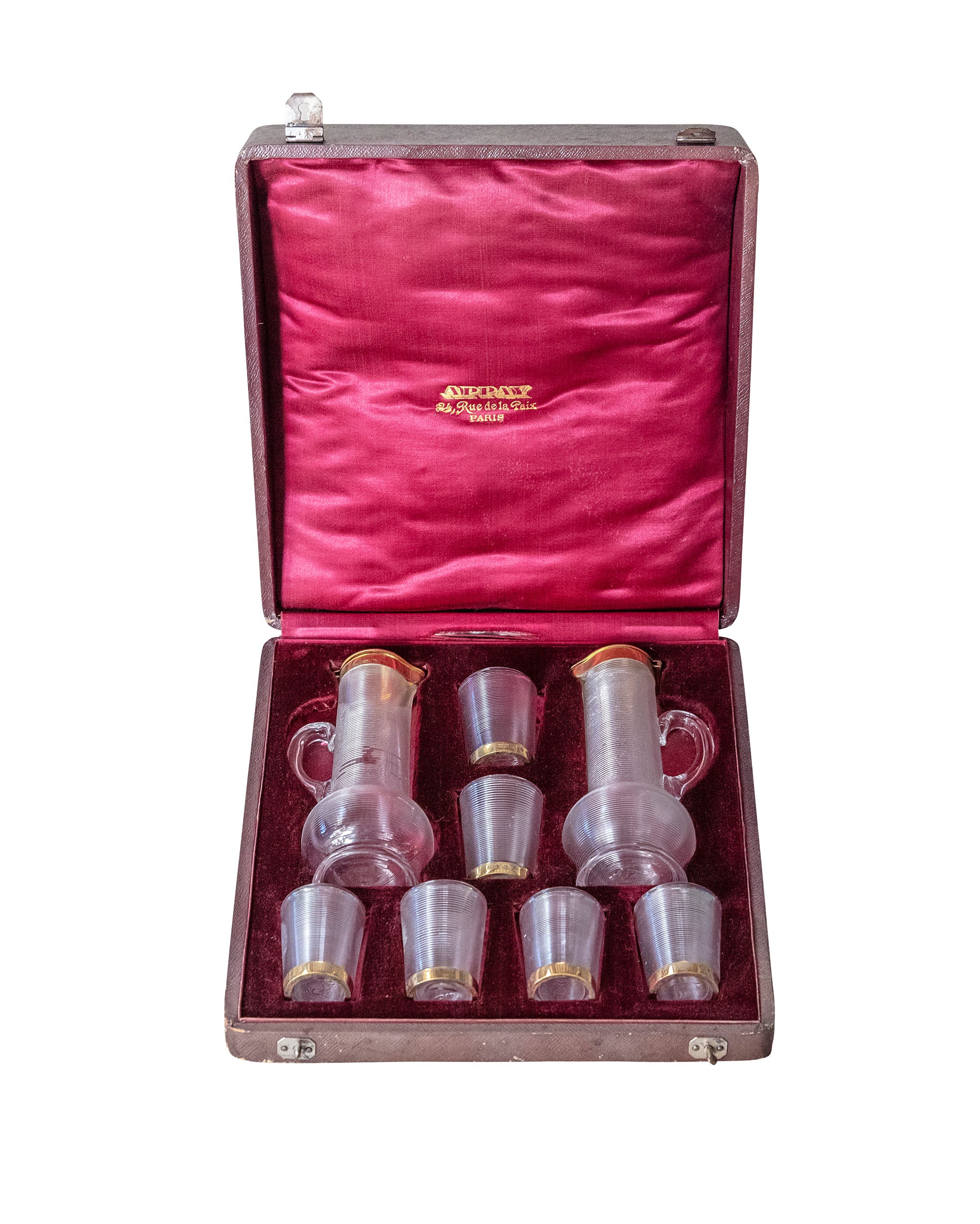 Aspay house liquor set consisting of two jugs and six Bacarrat glasses with golden edge. All in a leather case with original velvet