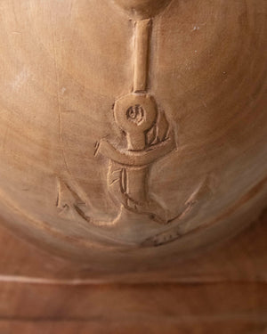 Wooden helmet with hand-carved marine emblem
