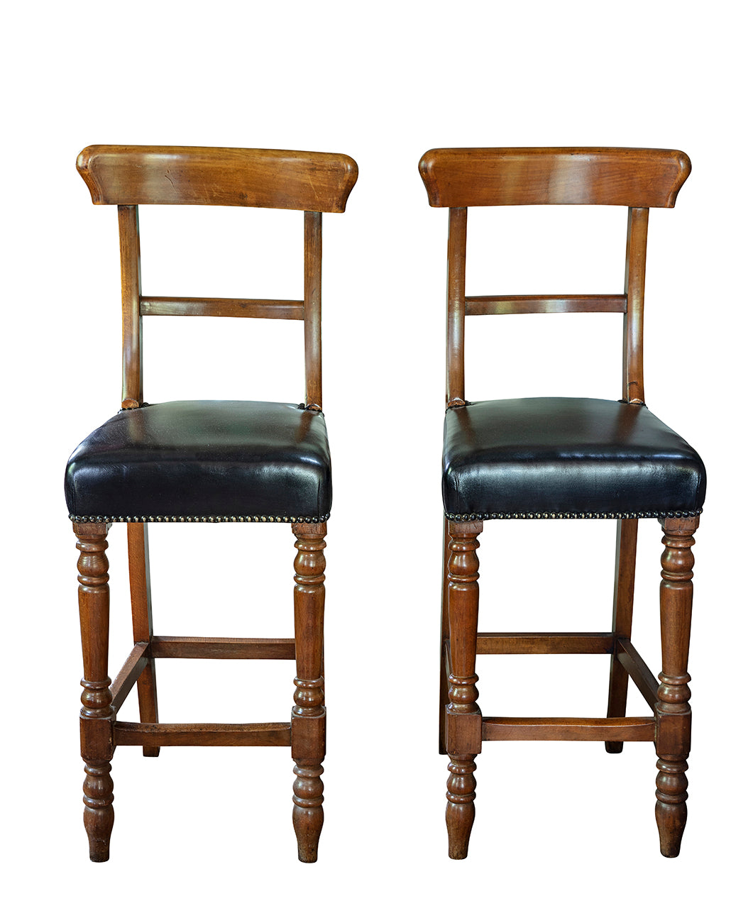 Pair of wood and leather bar stools. Beginning of the XXth century